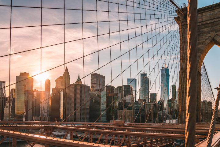 a view of a city with a bridge in the background