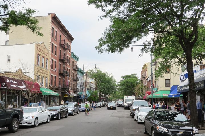 a car driving down a busy city street