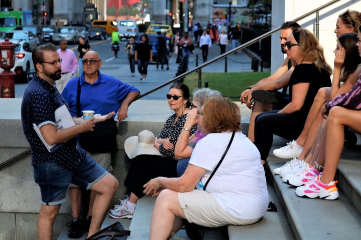 a group of people sitting on a bench