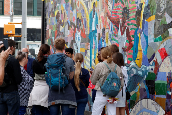 a group of people standing in front of a crowd